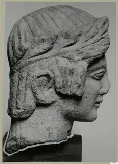 Limestone bust of a figure in right profile, with a grooved headdress, from Mersinaki.