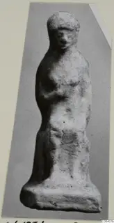 Terracotta figurine of a standing female figure, shown frontally on a flat base, from Vouni