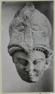 Limestone head with a tall headdress, from Vouni