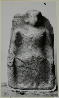 Limestone figure from Vouni, front view, with a rounded head and arms shown close to the sides