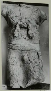 Limestone statue fragment from Vouni: a headless, armless torso with a band around the waist