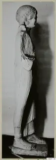 Limestone statue of a standing figure seen in side view, from Vouni