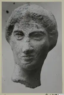 Terracotta head sculpture from Vouni with a broken neck, shown from the front