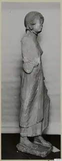 Limestone statue of a standing woman, seen in profile, from Vouni