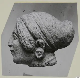 Limestone sculpture of a woman's head and bust in profile, from Vouni