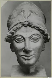 Limestone head of a figure wearing a tall cap, from Vouni