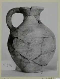 Pottery Plain White VII jug from Kition, reconstructed from joined sherds, with a strap handle