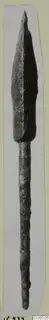 Bronze weapon point with long shank, from Vouni, shown upright on a card mount