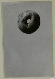 Ring-shaped object with a central hole, photographed from above, from Vouni