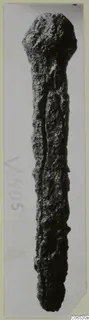 Corroded iron nail from Vouni, shown upright on a photo mount