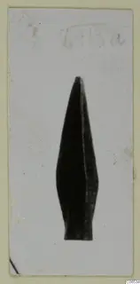 Arrowhead from Vouni, shown upright against a pale background on a card mount.