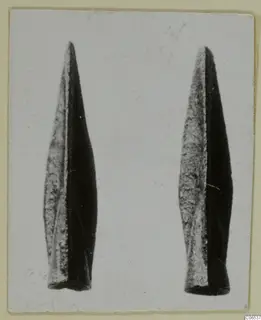 Two metal weapon blades, long and pointed, from Vouni, photographed side by side