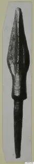 Bronze spearhead with a leaf-shaped blade and long tapering socket, shown upright on a pale card mount
