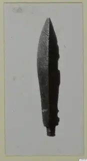 Leaf-shaped metal blade with a pointed tip and short tang, shown on a mounted print
