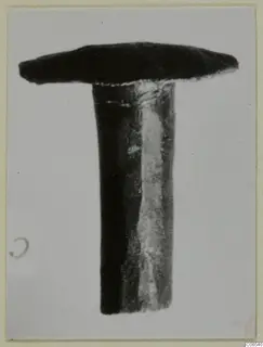Bronze nail from Vouni with a broad, flat head and a long plain shank