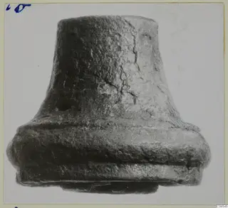 Bronze fragment from Vouni with a tapering upper part and a broad stepped collar at the base