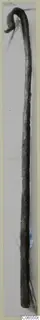 Long metal object with a curled hook at the top, photographed against a plain grey background.
