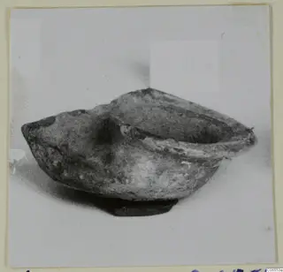 Terracotta lamp from Vouni with an open bowl-shaped body and a spout to the left