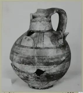 Jug of Pottery Bichrome III from Kition, with painted horizontal bands and vertical stripes on the body