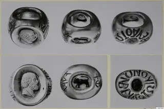Several views of rings with engraved bezels and lettering around the bands, shown on one mount.