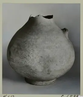 Cypro-Hell. I jug: globular pottery vessel with a broken, irregular rim and a short stub on one side