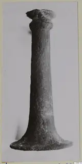Bronze incense-burner from Vouni: a tall, corroded metal stand with a flared foot and a cup-shaped top.