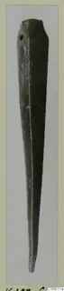 Bronze spearhead, a long tapering metal object with a small hole near the upper end, shown on a card mount