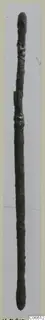 Long corroded bronze rod with a rounded knob at each end and a swelling near the top, a toilet requisite from Vouni.