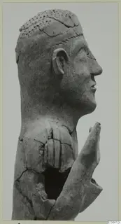 Terracotta statue of a man's head in profile with a raised hand, from Ayia Irini