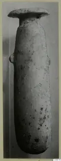 Stone vessel with a wide flat rim and two small handles, from the Vouni Korakas tombs, shown upright