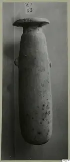Tall stone vessel with a flat disc-shaped rim and a small side handle, from Vouni