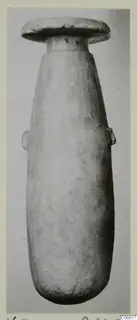 Alabaster vase from Vouni, a tall stone vessel with a disc-shaped rim and two small side lugs