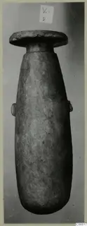 Alabaster vase from Vouni, Korakas tombs, with a flat disc-shaped rim and two small lugs on the body