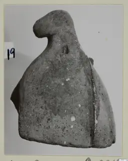 Bell-shaped find from Vouni T. 1-16, photographed on a mounted card with a number label