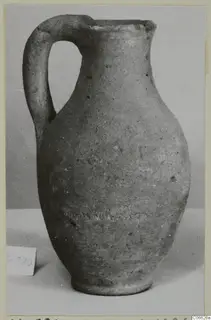 Pottery Plain White VII jug with a single loop handle and a narrow ring foot