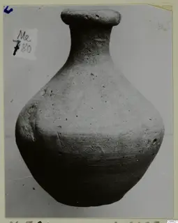 Pottery Plain White VII (M.780), a jug-shaped vessel with a wide flared rim and a rounded body