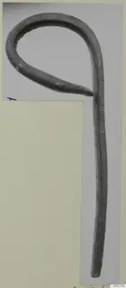 Bronze utensil handle bent into a loop at one end, from Vouni
