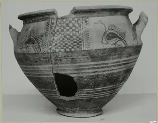 White Painted wheel-made pot with bird-like motifs and a checkerboard panel, side broken open