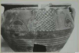White Painted wheel-made pottery jar with a checkerboard panel and long-necked motifs between zigzag bands
