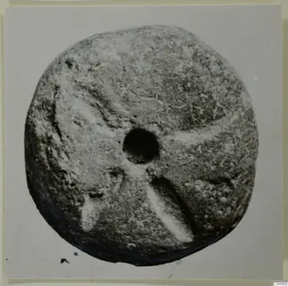 Terracotta disc with a central hole, from Soli