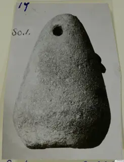 Terracotta loom weight from Soli, tapering with a round hole near the top
