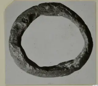 Lead ring, So.35, photographed on a plain card mount.