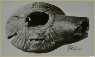 Terracotta lamp with radiating grooves on its shoulder, from Soli