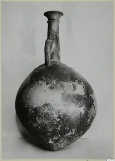 Red Polished II jug with a globular body, tall narrow neck, flared rim and a single vertical handle.