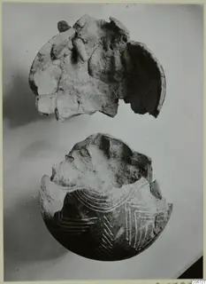 Pottery Red Polished II Jug: two broken pieces of a vessel, the lower one with white painted arcs and chevron lines
