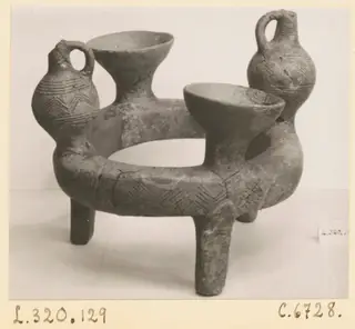 Ring-vase from Lapithos with two bowl-shaped cups and two jugs with loop handles on a ring-shaped body