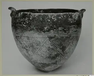 Red Polished I bowl from Lapithos with two small lug handles, grooved horizontal lines and diagonal hatched bands on its body
