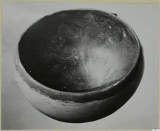Red Polished II bowl from the Vrysi tou Barba tombs at Lapithos, seen from above at an angle