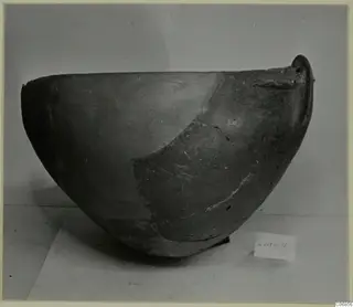 Red Polished II bowl with a small handle-like lug at the rim, shown on a plain surface with a number label.