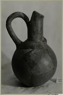Red Polished III jug with a single loop handle and tall neck, from Lapithos